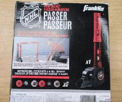 Franklin Sports NHL Mini Pasador Automático de Pelota de Hockey